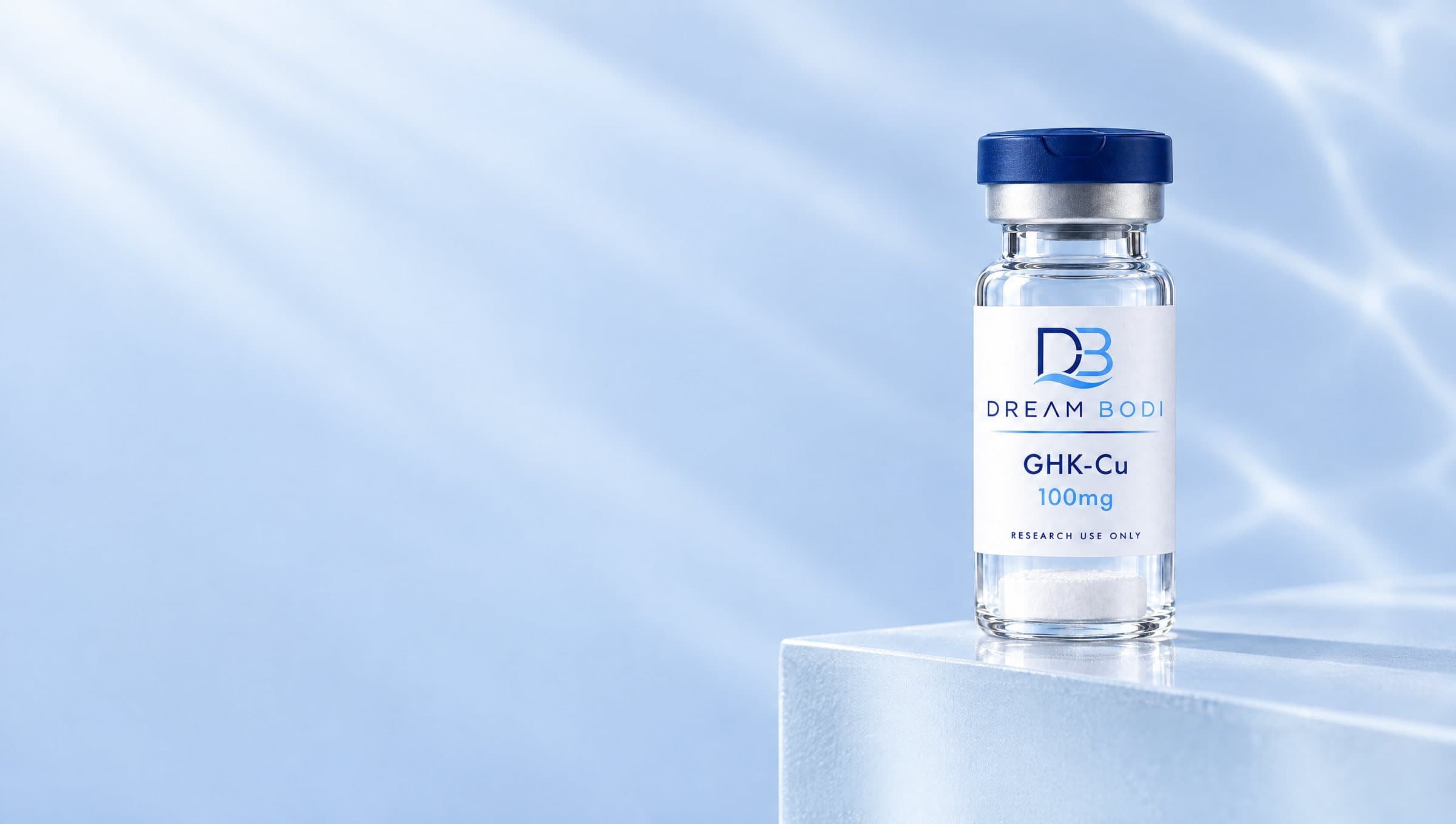 Dream Bodi vial on a frosted glass block in soft blue light